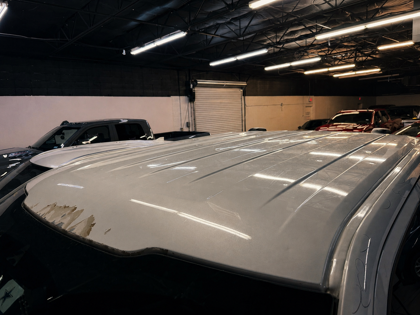 Full-size SUV — roof panel prepped for refinishing.